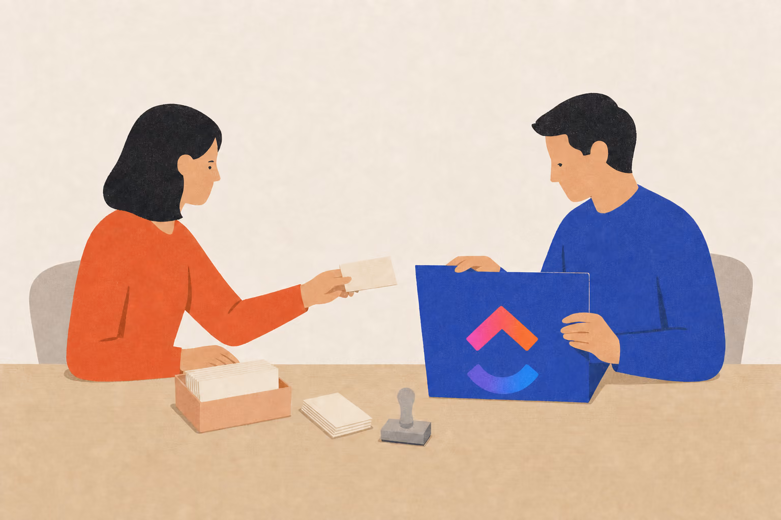 Two people assemble a client file as one hands over a contact card and the other opens a folder
