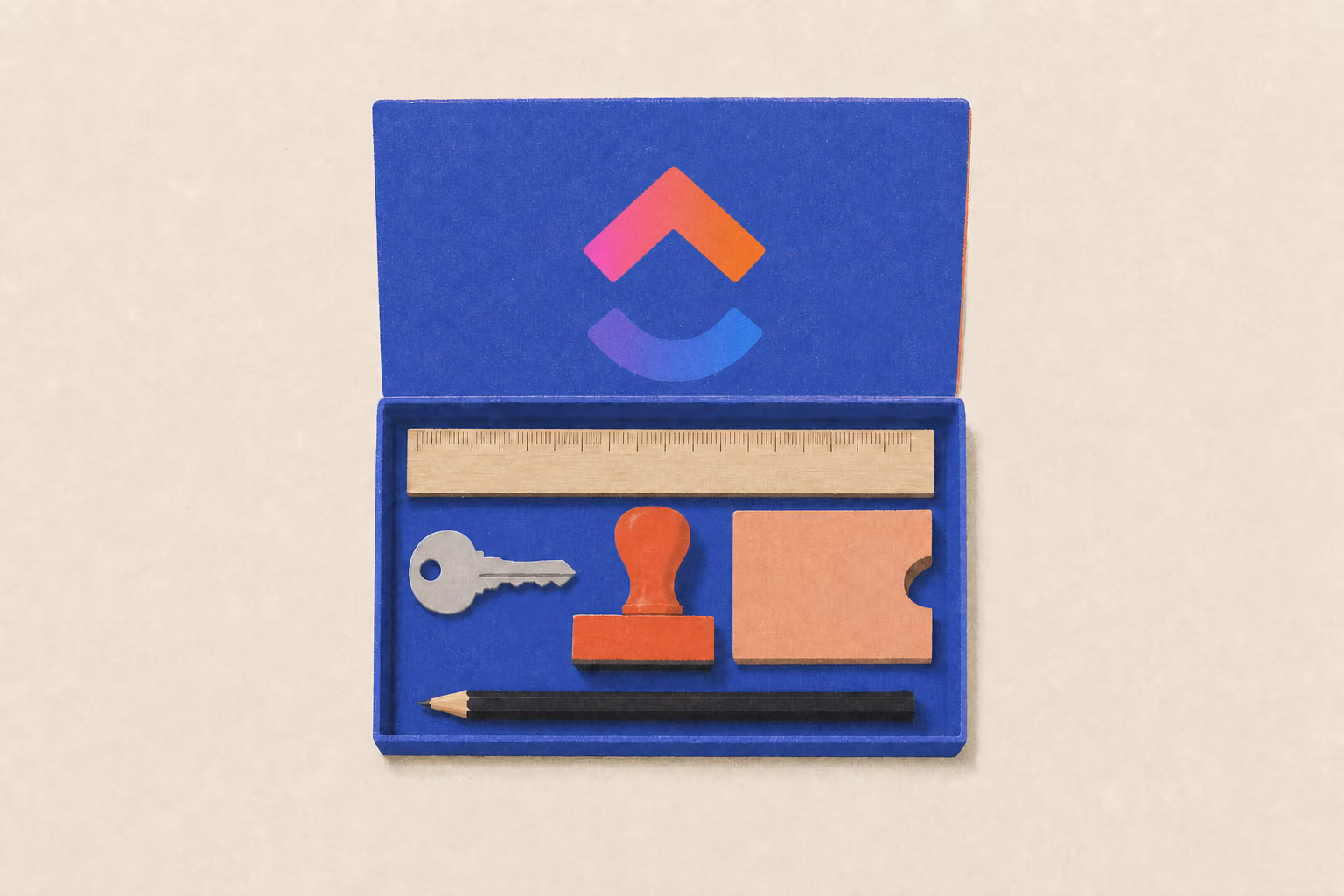 An open starter tray holds a ruler, key, stamp, card sleeve, and pencil